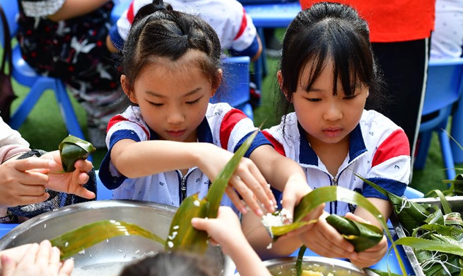 Activities held to celebrate upcoming Dragon Boat Festival across China